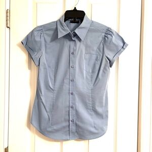 Fitted light blue button down top with short cuffed sleeves